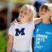 Friends and swimmers Anna Peters, 9, and Katie Krushelnick, 9, walk together outside during the Washtenaw Interclub Swim Conference championships at Skyline High School on Thursday, July 25, 2013. Melanie Maxwell | AnnArbor.com